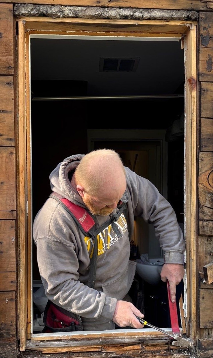 Titan team member preparing a residential window opening